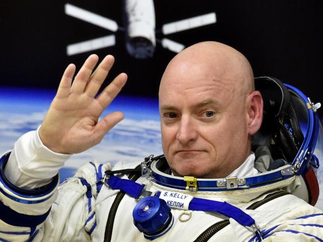 US astronaut Scott Kelly waves as his space suit is tested at the Russian-leased Baikonur cosmodrome, prior to blasting off to the International Space Station (ISS). Kelly and his Russian counterpart, Mikhail Kornienko, will return to Earth after spending nearly a year in space. (AFP Photo) US astronaut Scott Kelly waves as his space suit is tested at the Russian-leased Baikonur cosmodrome, prior to blasting off to the International Space Station (ISS). Kelly and his Russian counterpart, Mikhail Kornienko, will return to Earth after spending nearly a year in space. (AFP Photo)