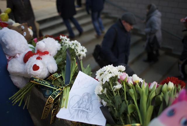 A child's illustration shows an angel among flowers outside a subway station in Moscow on Tuesday. (AP) A child's illustration shows an angel among flowers outside a subway station in Moscow on Tuesday. (AP)