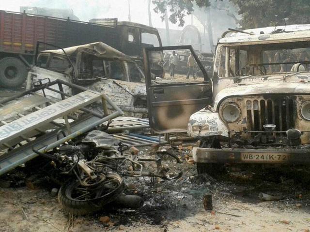 Vehicles set on fire after clashes between two groups at Kaliachak police station in Malda. (PTI File Photo) Vehicles set on fire after clashes between two groups at Kaliachak police station in Malda. (PTI File Photo)