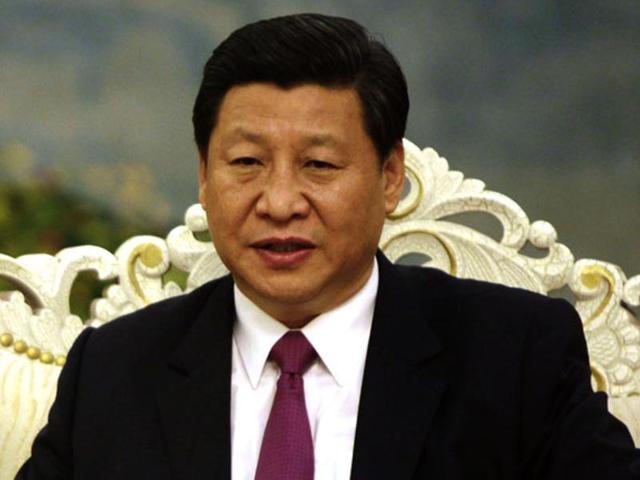 Chinese President Xi Jinping applauds after unveiling a sculpture during the opening ceremony of the Asian Infrastructure Investment Bank in Beijing on January 16. (AFP) Chinese President Xi Jinping applauds after unveiling a sculpture during the opening ceremony of the Asian Infrastructure Investment Bank in Beijing on January 16. (AFP)