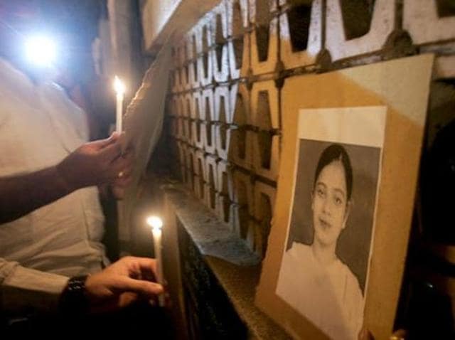 A file photo of demonstrators holding a candlelight vigil for Ishrat Jahan. A file photo of demonstrators holding a candlelight vigil for Ishrat Jahan.