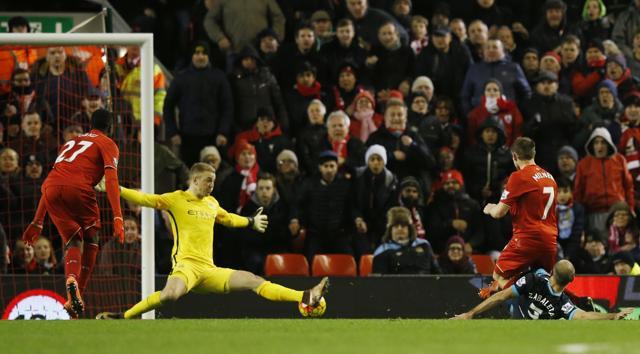 James Milner scores Liverpool’s second goal past Joe Hart. (Reuters Photo) James Milner scores Liverpool’s second goal past Joe Hart. (Reuters Photo)