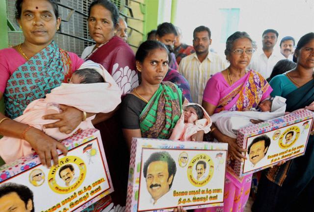 DMK members gift gold chains and baby-sets in a hospital on MK Stalin’s 64th birthday, in Coimbatore. (PTI Photo)