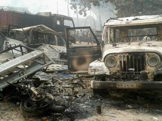 Vehicles set on fire after clashes between two groups at Kaliachak police station in Malda on Sunday, January 3, 2016. Both CPI(M) and BJP think it was Mamata Banerjee’s administration and Trinamool men who allowed, if not staged, the rioting at Kaliachak in which BSF men were assaulted and their vehicle was set afire. (PTI) Vehicles set on fire after clashes between two groups at Kaliachak police station in Malda on Sunday, January 3, 2016. Both CPI(M) and BJP think it was Mamata Banerjee’s administration and Trinamool men who allowed, if not staged, the rioting at Kaliachak in which BSF men were assaulted and their vehicle was set afire. (PTI)