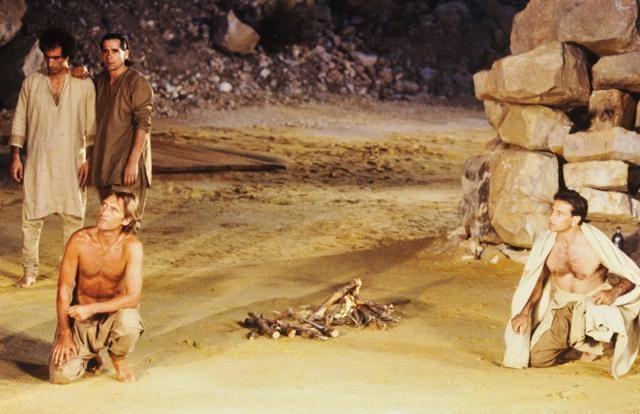 The Pandavas in exile — Yudhishthira (left, played by actor Matthias Habich) and Arjuna (Vittorio Mezzogiorno) on stage at Avignon Festival. (Photo: Daniel Cande/ Wikipedia Commons) The Pandavas in exile — Yudhishthira (left, played by actor Matthias Habich) and Arjuna (Vittorio Mezzogiorno) on stage at Avignon Festival. (Photo: Daniel Cande/ Wikipedia Commons)