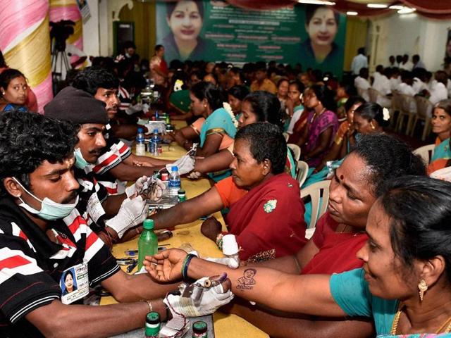 AIADMK party cadres getting the image of Tamil Nadu Chief Minister J Jayalalithaa tattooed on their hands. Tamil Nadu will have a single phase polling on May 16. (PTI File) AIADMK party cadres getting the image of Tamil Nadu Chief Minister J Jayalalithaa tattooed on their hands. Tamil Nadu will have a single phase polling on May 16. (PTI File)