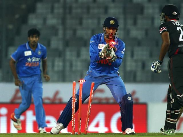 India’s captain Mahendra Dhoni takes the wicket of United Arab Emirates’ Farhan Ahmed. (AP Photo) India’s captain Mahendra Dhoni takes the wicket of United Arab Emirates’ Farhan Ahmed. (AP Photo)