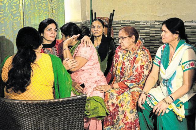 Family members of Shipra Malik at their residence in Noida. The family is seeking help on WhatsApp groups. (Burhaan Kinu/HT Photo)