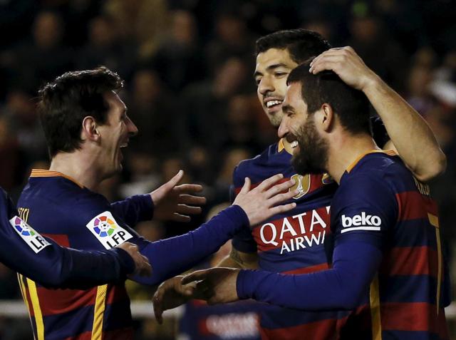 Barcelona's Arda Turan celebrates with team mates Lionel Messi and Luis Suarez after scoring a goal. (REUTERS) Barcelona's Arda Turan celebrates with team mates Lionel Messi and Luis Suarez after scoring a goal. (REUTERS)
