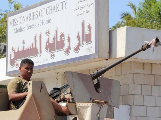 Yemeni pro-government fighters gather outside an elderly care home in Aden after it was attacked by gunmen on Thursday. (AFP) Yemeni pro-government fighters gather outside an elderly care home in Aden after it was attacked by gunmen on Thursday. (AFP)