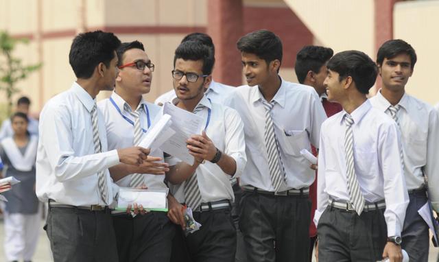 Students discuss their question paper after the board examination in Lucknow. (DEEPAK GUPTA/HT Photo)