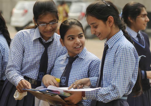 Students discuss their question paper after the board examination in Lucknow. (DEEPAK GUPTA/HT Photo)
