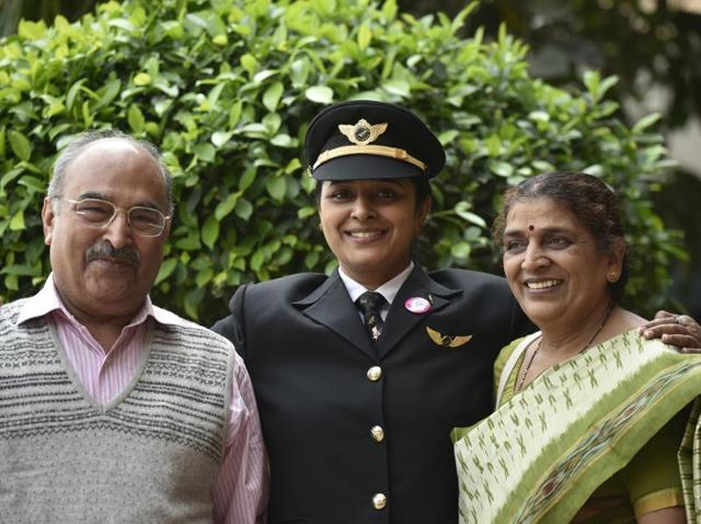 ‘Glad you’re our daughter!’: First Officer Captain Ramya Kirti Gupta with her parents at the function to celebrate a historic New Delhi -San Francisco flight. (Vipin Kumar / HT Photo) 