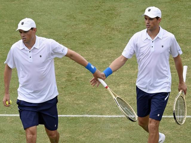 Team captain Lleyton Hewitt and John Peers of Australia as they play against Mike and Bob Bryan.(AFP Photo)