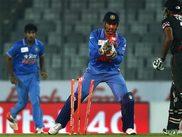 India’s captain Mahendra Dhoni takes the wicket of United Arab Emirates’ Farhan Ahmed. (AP Photo) India’s captain Mahendra Dhoni takes the wicket of United Arab Emirates’ Farhan Ahmed. (AP Photo)