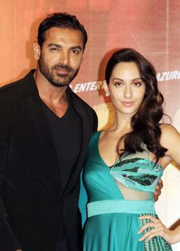 John Abraham (L) and Nora Fatehi pose for a photograph during a promotional event for the forthcoming Hindi film Rocky Handsome. (AFP) John Abraham (L) and Nora Fatehi pose for a photograph during a promotional event for the forthcoming Hindi film Rocky Handsome. (AFP)