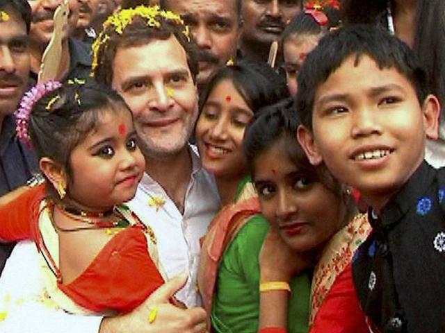 Congress vice-president Rahul Gandhi poses for photographs with children during his Padyatra in Nagaon on Saturday. (PTI) Congress vice-president Rahul Gandhi poses for photographs with children during his Padyatra in Nagaon on Saturday. (PTI)