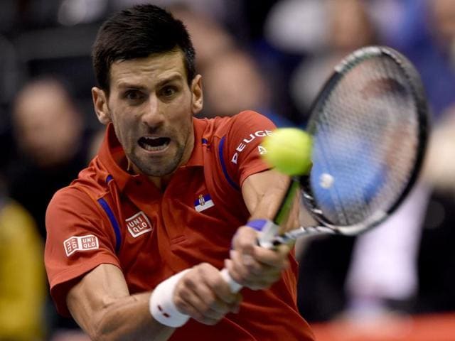 Novak Djokovic returns a shot to Aleksandr Nedovyesov during the Davis Cup World Group. (AFP Photo) Novak Djokovic returns a shot to Aleksandr Nedovyesov during the Davis Cup World Group. (AFP Photo)