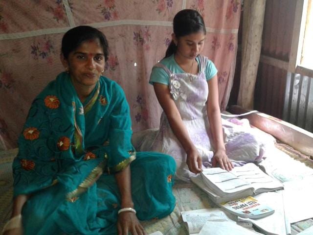 Smriti Banik studying for the ongoing matriculation examinations with her daughter at Purba Laxmibil village in Tripura. (HT Photo) Smriti Banik studying for the ongoing matriculation examinations with her daughter at Purba Laxmibil village in Tripura. (HT Photo)