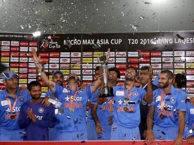 A victorious Team India pose with the Asia Cup trophy as confetti is showered on them during the presentation ceremony. (AP Photo) A victorious Team India pose with the Asia Cup trophy as confetti is showered on them during the presentation ceremony. (AP Photo)