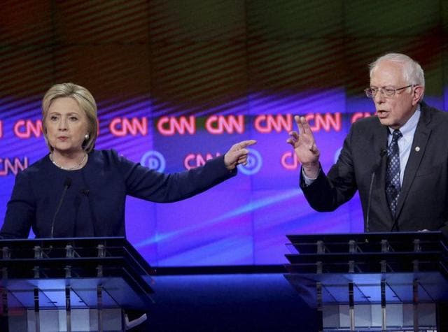In this file photo, Democratic presidential candidates Hillary Clinton and Sen. Bernie Sanders argue a point during a Democratic presidential primary debate at the University of Michigan-Flint. (AP) In this file photo, Democratic presidential candidates Hillary Clinton and Sen. Bernie Sanders argue a point during a Democratic presidential primary debate at the University of Michigan-Flint. (AP)