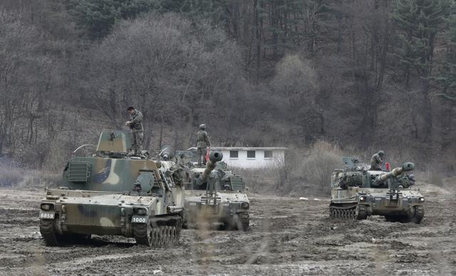 South Korean troops stand atop K-55 self-propelled howitzers during an annual exercise in Paju, near the border with North Korea, on Monday. (AP)