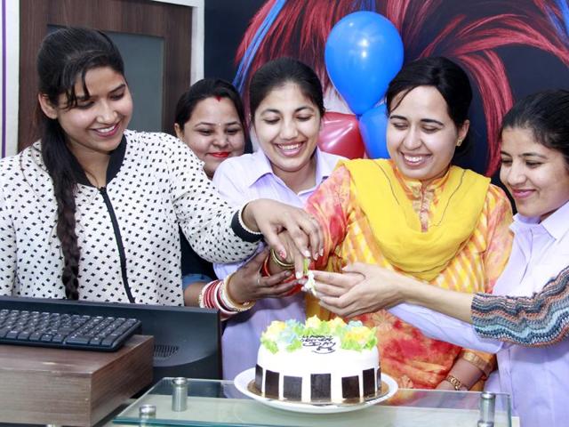 Employees of a salon in Bathinda in jubilant mood as they celebrate International Women’s Day. (Sanjeev Kumar/HT )