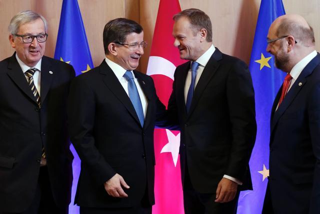 (L-R) European Commission president Jean-Claude Juncker, Turkey's Prime Minister Ahmet Davutoglu, European Council President Donald Tusk and European Parliament President Martin Schulz talk at the EU leaders summit with Turkey on the migrants crisis in Brussels on Monday. (AFP) (L-R) European Commission president Jean-Claude Juncker, Turkey's Prime Minister Ahmet Davutoglu, European Council President Donald Tusk and European Parliament President Martin Schulz talk at the EU leaders summit with Turkey on the migrants crisis in Brussels on Monday. (AFP)