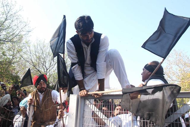 Earlier, at 9 am, over a dozen Congress MLAs, led by Congress Legislature Party (CLP) leader Charanjeet Singh Channi, wearing black bands and carrying black flags, began a march from the high court chownk, roughly half a kilometer from the Vidhan Sabha. (Keshav Singh/HT Photo) Earlier, at 9 am, over a dozen Congress MLAs, led by Congress Legislature Party (CLP) leader Charanjeet Singh Channi, wearing black bands and carrying black flags, began a march from the high court chownk, roughly half a kilometer from the Vidhan Sabha. (Keshav Singh/HT Photo)