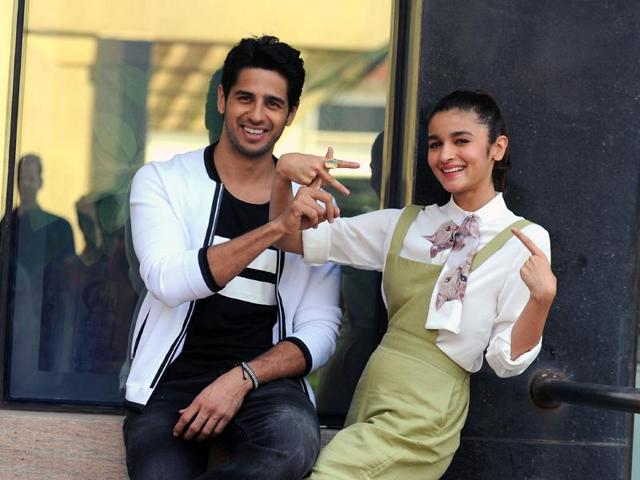 Sidharth Malhotra and Alia Bhatt pose and gesture during a promotional event for the upcoming  film Kapoor & Sons where Sidharth Malhotra’s character Arjun Kapoor pines for Alia Bhatt’s character. (AFP) 