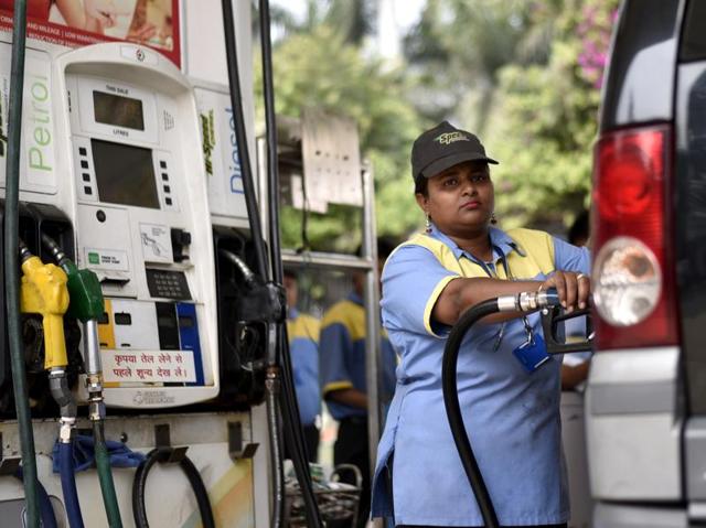 Saima, a 30-year-old employee of a Petrol pump continues with her daily schedule. (Arun Sharma/HT Photo)