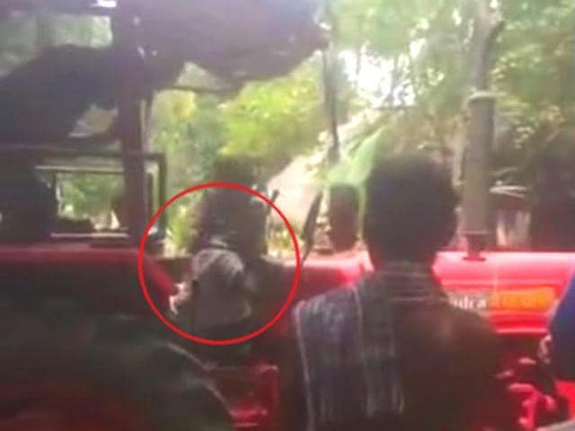 A screengrab of the video shows the farmer being thrashed by the recovery agents of a finance company. A screengrab of the video shows the farmer being thrashed by the recovery agents of a finance company.