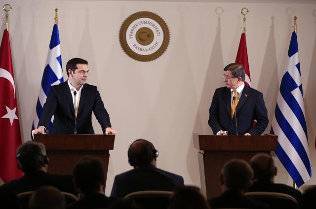 Turkey's Prime Minister Ahmet Davutoglu, right, listens to Greece's Prime Minister Alexis Tsipras, during a joint news conference, following their meeting, in Izmir, Turkey, Tuesday, March 8, 2016. (AP Photo) Turkey's Prime Minister Ahmet Davutoglu, right, listens to Greece's Prime Minister Alexis Tsipras, during a joint news conference, following their meeting, in Izmir, Turkey, Tuesday, March 8, 2016. (AP Photo)
