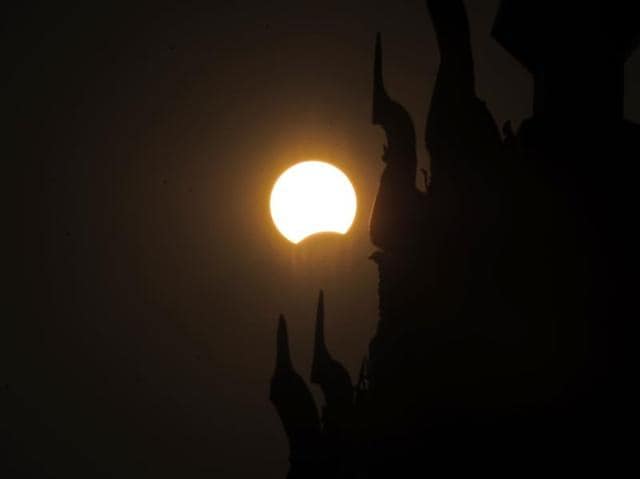 This picture shows the moon passing in front of the sun during the partial solar eclipse in Naypyidaw on Wednesday morning. A total solar eclipse swept across the vast Indonesian archipelago on March 9, witnessed by tens of thousands of sky gazers and marked by parties, Muslim prayers and tribal rituals. Partial eclipses were also visible over other parts of Asia and Australia. / AFP / YE AUNG THU (AFP)