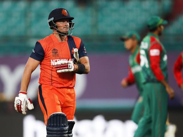 Roelof van der Merwe of the Netherlands walks back after his dismissal. (AP Photo)