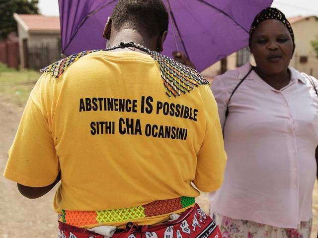 Maiden bursary holders, Bongiwe Sithole 32, and Thubelihle Dlodlo 18, take an afternoon walk, wearing their maiden attire, through their hometown with their matrons on the outskirts of Ladysmith, South Africa. (AFP Photo) Maiden bursary holders, Bongiwe Sithole 32, and Thubelihle Dlodlo 18, take an afternoon walk, wearing their maiden attire, through their hometown with their matrons on the outskirts of Ladysmith, South Africa. (AFP Photo)