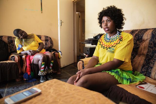 This picture shows maiden bursary holder, Thubelihle Dlodlo 18, speaking on her reasons for wanting to remain a virgin while her friend and fellow maiden bursary holder, Bongiwe Sithole 32, looks on. (AFP Photo) This picture shows maiden bursary holder, Thubelihle Dlodlo 18, speaking on her reasons for wanting to remain a virgin while her friend and fellow maiden bursary holder, Bongiwe Sithole 32, looks on. (AFP Photo)