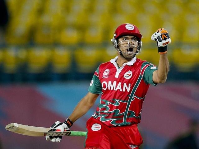 Oman's Ajay Lalcheta celebrates after they won the ICC World T20 qualifier match against Ireland at the Himachal Pradesh Cricket Association (HPCA) stadium in Dharmsala on March 9, 2016. Oman won by two wickets. (AP) 
