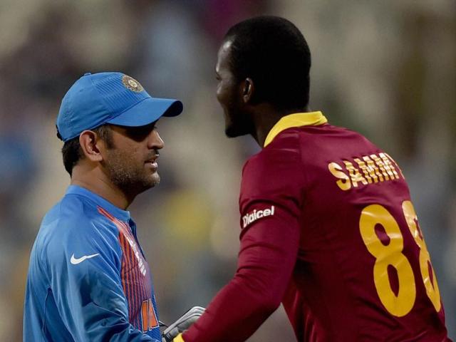 Indian skipper M S Dhoni and Darren Sammy captain of West Indies greet each other. (PTI Photo) Indian skipper M S Dhoni and Darren Sammy captain of West Indies greet each other. (PTI Photo)