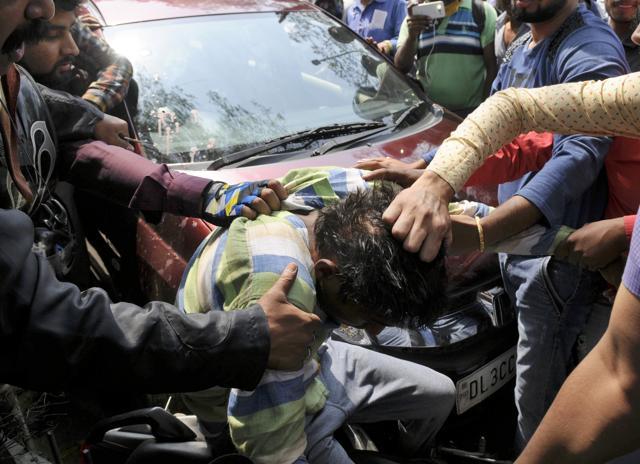 One of the attackers who fell from the bike. (Burhaan Kinu/HT Photo) One of the attackers who fell from the bike. (Burhaan Kinu/HT Photo)