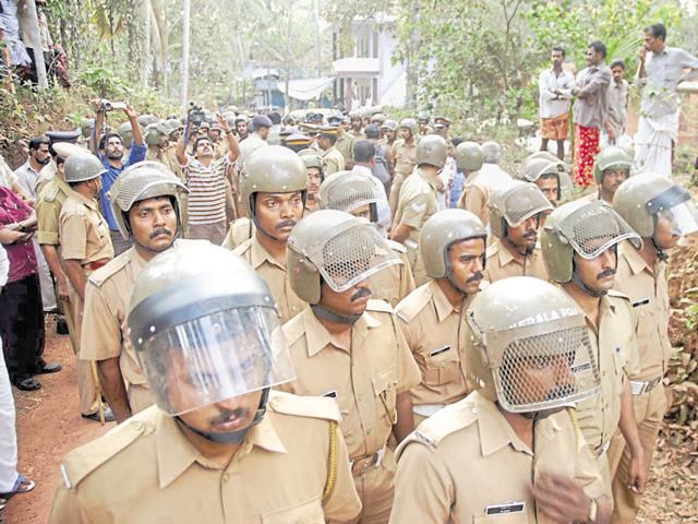 Police keep vigil in Kannur. Locals say enmity between the two sides goes back to the 1960s when RSS began eyeing the district.(K Sasi/HT Photo)