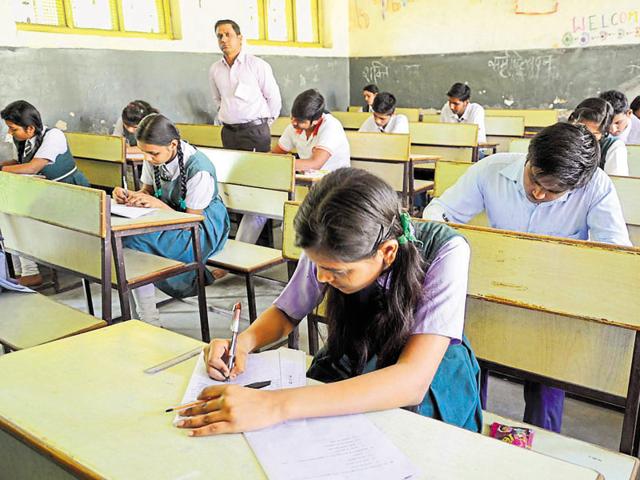Students taking MP board exam at Govt. Naveen girls higher secondary school in Bhopal.(Mujeeb Faruqui/ Hindustan Times) Students taking MP board exam at Govt. Naveen girls higher secondary school in Bhopal.(Mujeeb Faruqui/ Hindustan Times)