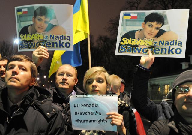 People hold pictures of Ukrainian pilot Nadezhda Savchenko during a rally demanding freedom for her, outside the Russian Embassy in Warsaw, Poland on Wednesday. (AP) People hold pictures of Ukrainian pilot Nadezhda Savchenko during a rally demanding freedom for her, outside the Russian Embassy in Warsaw, Poland on Wednesday. (AP)