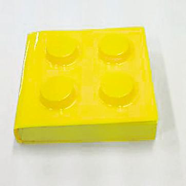 The Lego notebooks, which come in a variety of colours, are shaped like building blocks.
