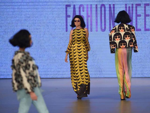 Feeha used the motif of a dark-haired girl with round sunglasses in her designs and even made her mode carry the same look. (AFP) Feeha used the motif of a dark-haired girl with round sunglasses in her designs and even made her mode carry the same look. (AFP)