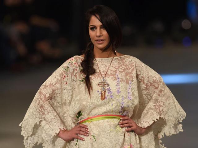 A model presents a creation by Pakistani designer Sana Safinaz. The lace is so overpowering. (AFP) A model presents a creation by Pakistani designer Sana Safinaz. The lace is so overpowering. (AFP)