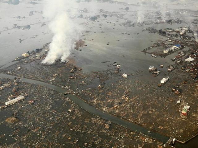 Aerial view shows tsunami damage and flooding in Natori, Miyagi prefecture, after the earthquake and tsunami triggered an emergency at a nuclear power plant. (AFP File Photo)