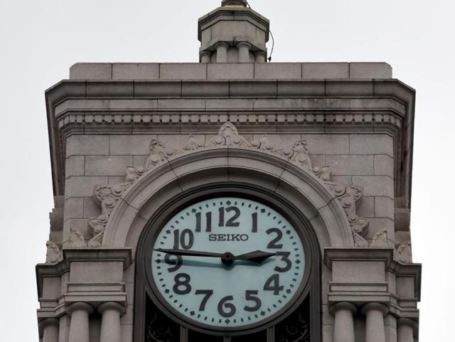 A clock in Tokyo shows 14:46 local time, the time the earthquake struck Japan on March 11. (AFP Photo)