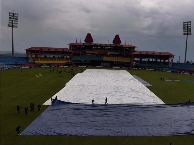 Groundsmen cover pitch due to rains during the T20 World Cup match. (PTI Photo)