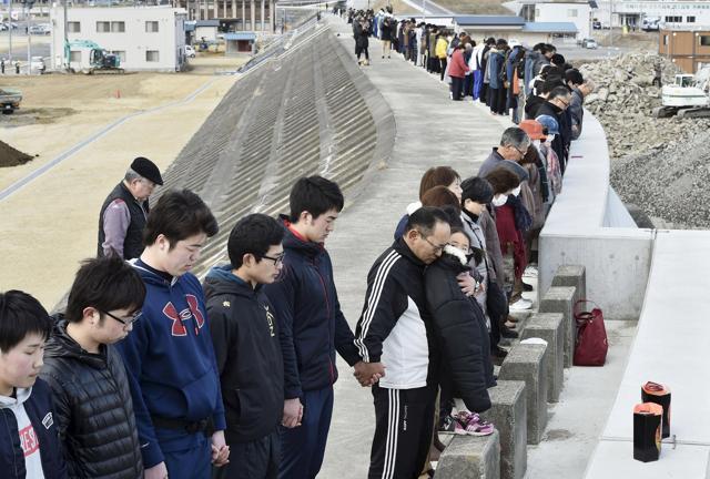 People observe a moment of silence at 2:46 pm (0546 GMT). (Reuters Photo)